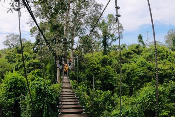 One Day Guided Tour: Kayaking, Zipline & Tubing In The Cave from Vang Vieng - Swimming at the cave mouth: a cool spring-water intermission