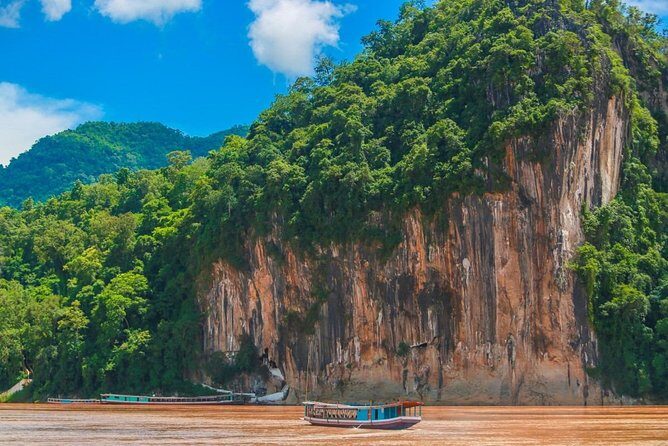 Pak Ou Caves and Kuang Si Fall Day Tour - Kuang Si Falls: Three Tiers, a 50-Metre Drop, and Swimming Holes
