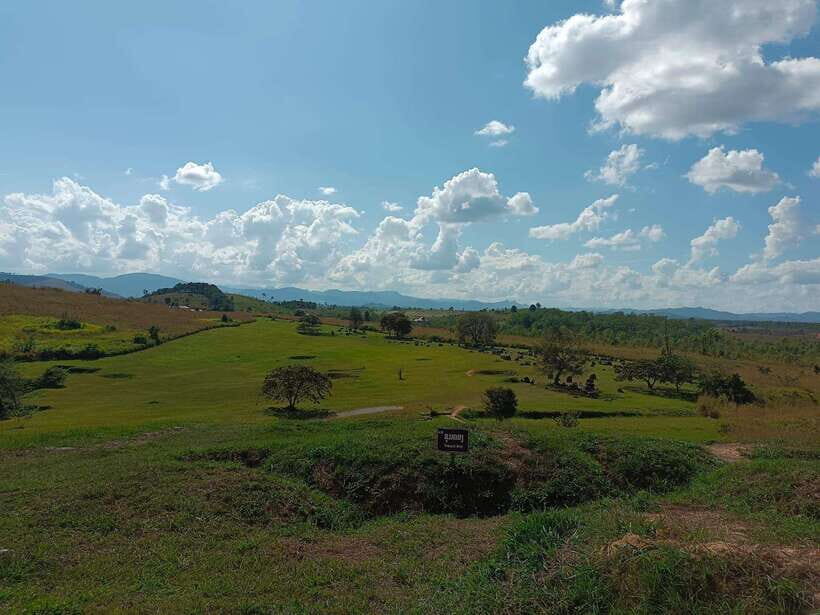 Plain of jars private tour - Site 3 at Ban Xieng Di: rice fields, then the jars